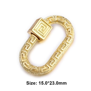 Macro shot of gold metal oval carabiner with Greek pattern, size 15.0x23.0mm detail