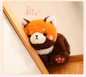 Macro view of a cute red panda plush slap bracelet featuring soft fur and pink paw.