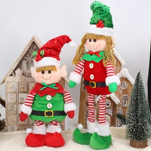 Detail of plush Christmas elves with sequins and retractable legs on wooden decor