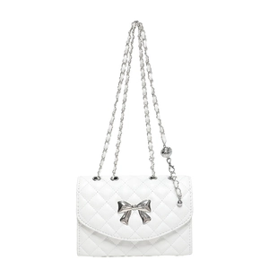 White quilted shoulder bag with silver bow accent and adjustable chain strap