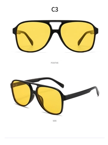 Detail view of aviator sunglasses with black frames and yellow lenses from two angles