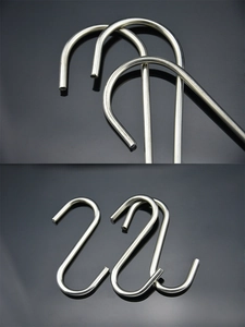 Macro detail of polished stainless steel S-shaped hooks for kitchen and bathroom hanging