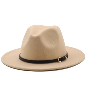 Detail of beige wool felt fedora featuring a black leather band and gold metal buckle
