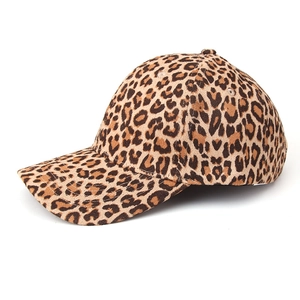 Detailed side view of leopard print baseball cap with curved brim and textured fabric