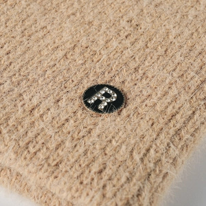 Women's warm camel knit beanie with plush mohair texture and rhinestone 'R' letter badge