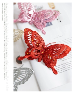 Detailed macro view of glittery Christmas butterfly ornaments in various festive colors