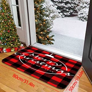 Détail du paillasson de Noël à carreaux rouges 80x50cm avec motif de traîneau