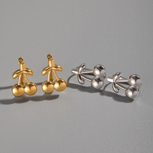 Polished cherry earrings in gold and silver finish with leaf detail and shiny luster