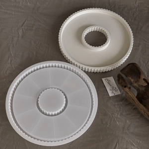 Detailed view of textured round silicone molds for resin casting and plaster tray DIY