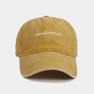 Detailed close-up of mama embroidery on vintage washed ginger cotton baseball cap