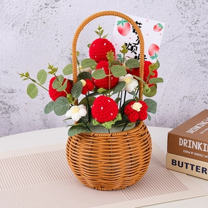 Handmade crochet strawberry flower bouquet in a woven basket with greeting card