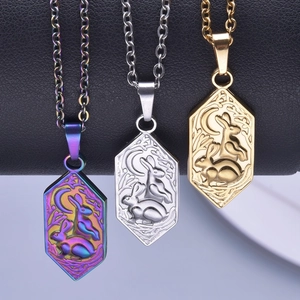 Three 18k plated hexagon rabbit moon pendants in rainbow, gold, and silver finishes