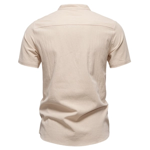 Back view of light beige cotton linen shirt for men featuring a minimalist stand collar