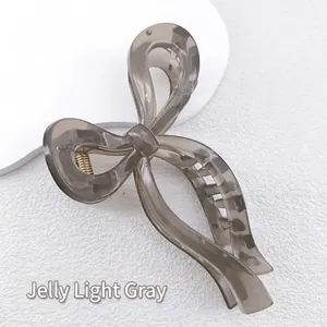 Jelly light gray hair claw clip with elegant bow design and durable metal spring detail