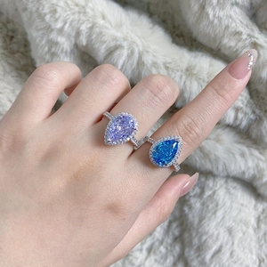 Detailed view of teardrop pear-cut lavender purple and blue zircon rings in S925 silver