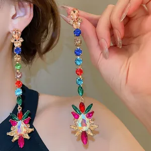 Colorful long tassel rhinestone drop earrings with starburst design in gold finish