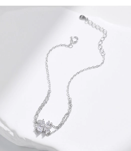 Detailed view of S925 sterling silver stamp on clover charm double-layer bracelet
