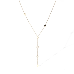 Detailed view of long Y-shaped necklace with black enamel and gold round pendant charms