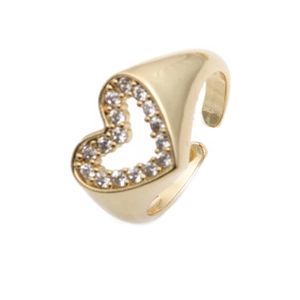 Macro shot of gold-plated heart ring featuring pavé-set cubic zirconia crystals
