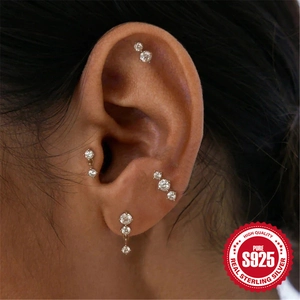 925 sterling silver earring set with white cubic zirconia worn on a female model