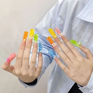 Handmade 3D gummy bear press-on nails with colorful candy charms and heart pearls