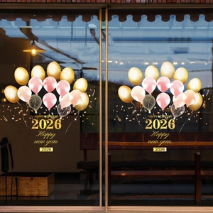 2026 Happy New Year golden balloon window stickers on a glass storefront door