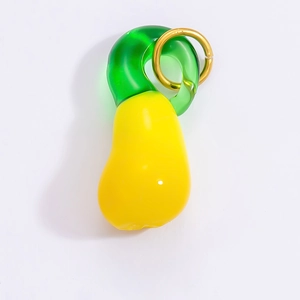 Detailed view of pear-shaped glass charm with 18k gold-plated ring and glossy finish