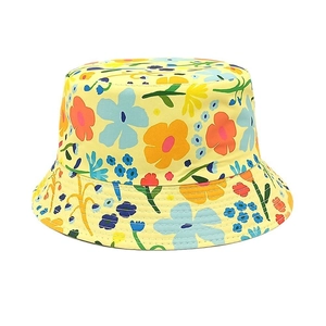 Detail of yellow floral bucket hat showing cotton twill fabric and reinforced brim stitching