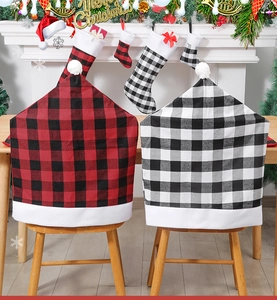 Close-up of red and black buffalo plaid Christmas chair covers and matching stockings