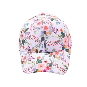 Cute floral print children baseball cap with pink and orange flowers on white background