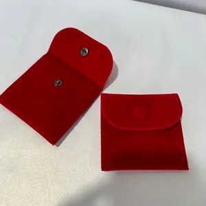 Red velvet jewelry pouch with metal snap closure in various sizes for ring storage
