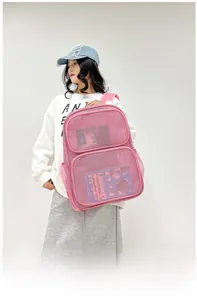 Detail showing pink mesh backpack texture and side water bottle pocket on a model