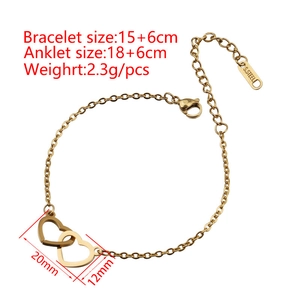Macro detail of intertwined gold heart charms on a stainless steel adjustable chain