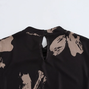 Back view of bodycon dress with mock neck and teardrop opening featuring abstract floral print