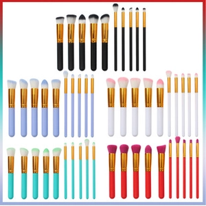 Macro shot of colorful 15-piece watercolor makeup brush sets with premium golden ferrules