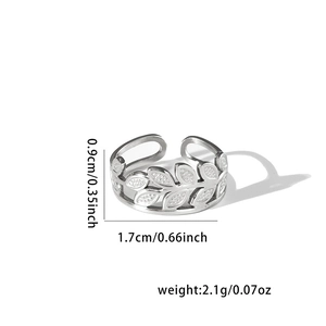 Detail view of leaf pattern titanium steel ring showing 0.9cm width and 1.7cm diameter