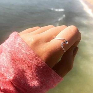 Minimalist silver wave ring for women crafted in stainless steel for a beach aesthetic