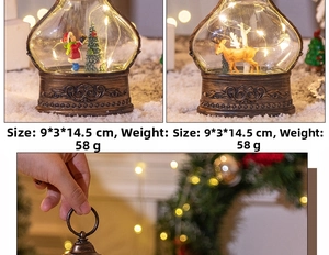 Detail of LED Christmas lantern with miniature Santa and tree in warm bokeh lighting