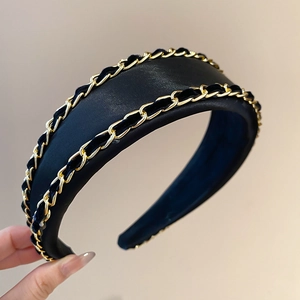 Detail of vintage fabric headband with gold chain texture and thick padded structure