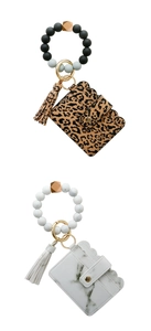 Detail of silicone bead wristlet with leopard print and marble pattern wallet keychains