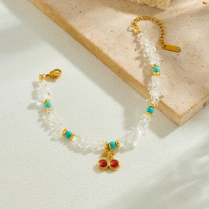 Handmade beaded bracelet with red cherry pendant and white natural turquoise stones