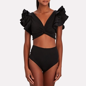 Close-up of black bikini set featuring ruffled sleeves and high-waisted bottom design