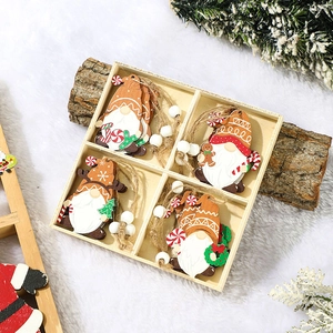 Detailed view of hand-painted wooden Christmas gnomes with white beads and jute twine