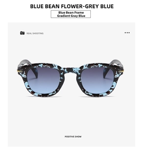 Front view of retro round blue tortoise shell sunglasses with gradient grey blue lenses