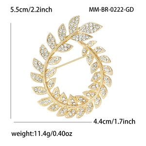 Detailed dimensions of gold olive branch brooch with rhinestones showing 5.5cm by 4.4cm size