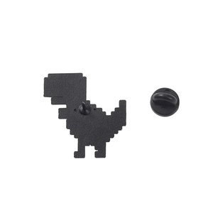 8-bit pixel art dinosaur brooch in black enamel with secure rubber clutch back