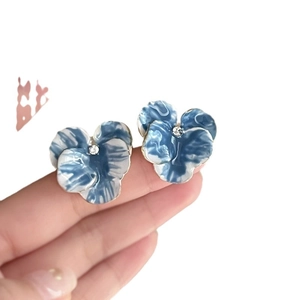 Blue enamel iris flower stud earrings with gold plating and sparkling center crystal