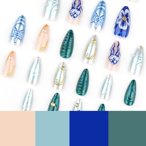 3D ocean-themed press-on nails with pearls, starfish, and jellyfish on almond-shaped tips
