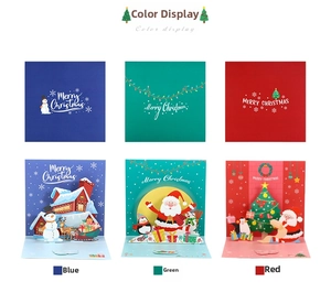 Detailed view of 3D Christmas cards with pop-up scenes in blue, green and red designs