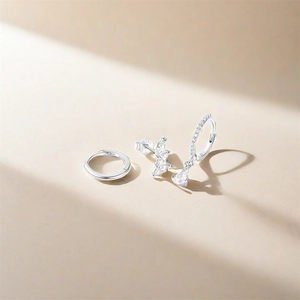 Close-up of S925 sterling silver earring set with turquoise and clear zircon accents